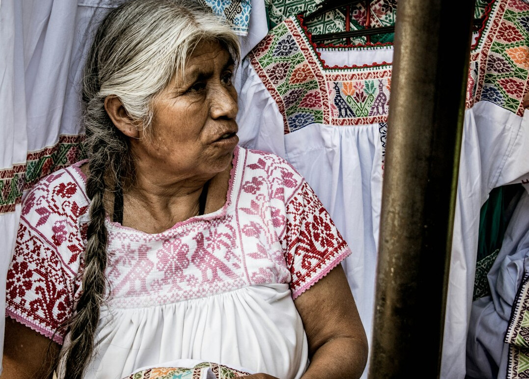 woman teaching embroidery