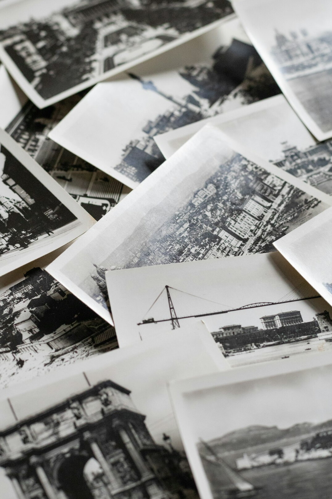 Wall covered with printed documentary photographs in an archive