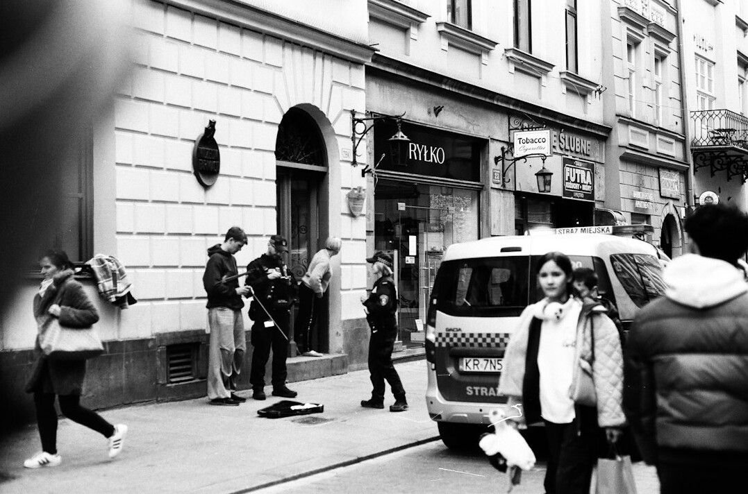 Group portrait of four Polish photographers and journalists